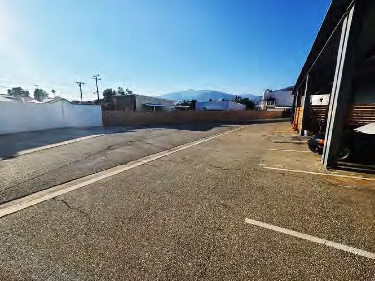 The secured side parking lot with mountains behind
